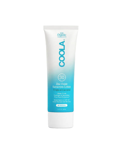 Coola sunscreen lotion tube on a light gray background