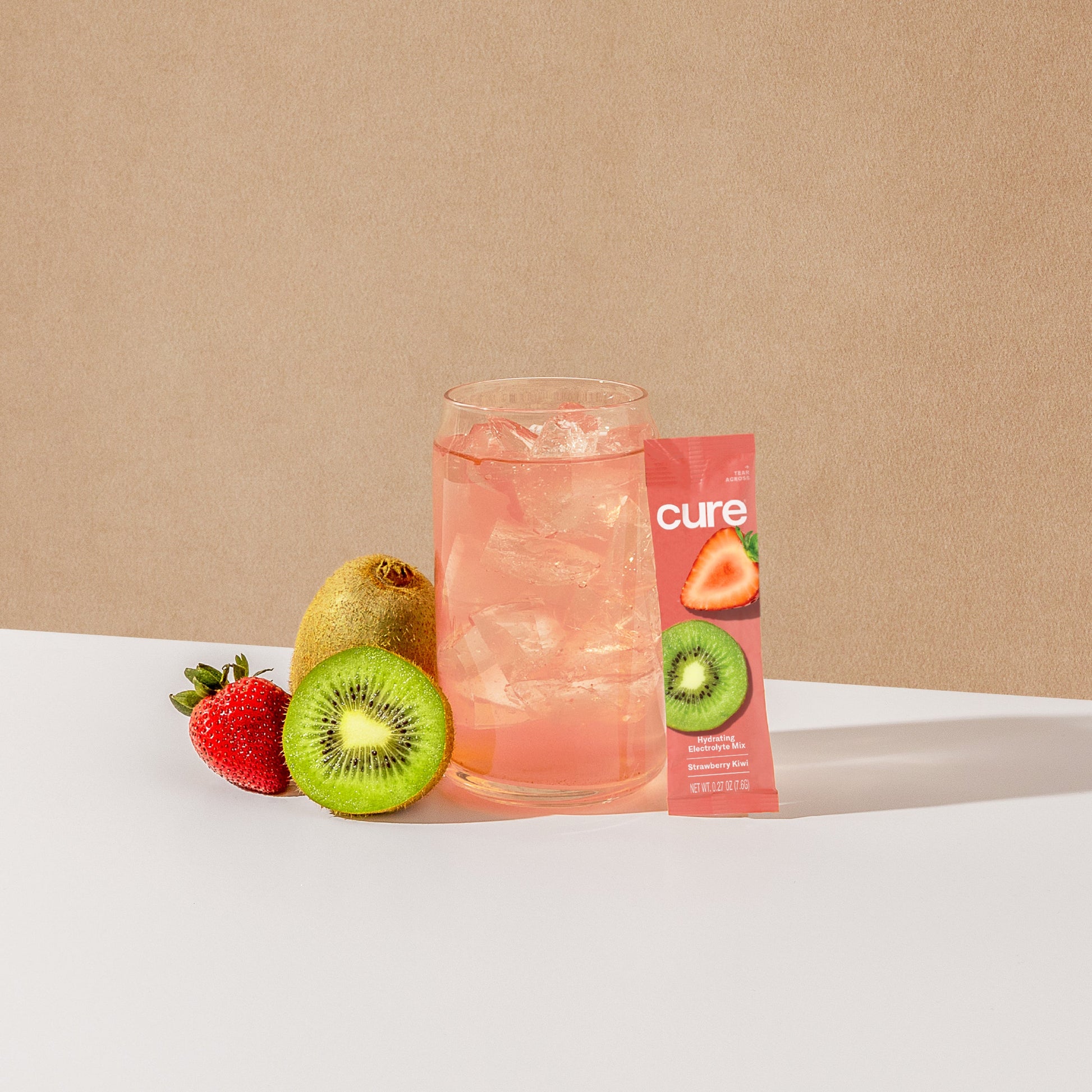  Pink drink with a strawberry kiwi mix packet and fresh fruits.