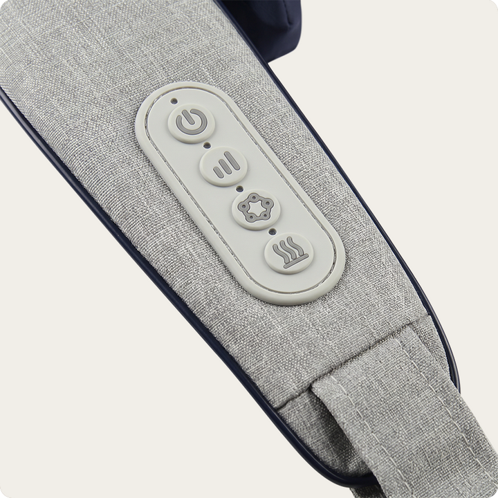Close-up of a gray fabric massage or pillow strap with an oval control panel featuring four buttons on a light beige background.