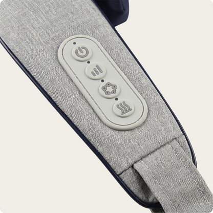 Close-up of a gray fabric massage or pillow strap with an oval control panel featuring four buttons on a light beige background.